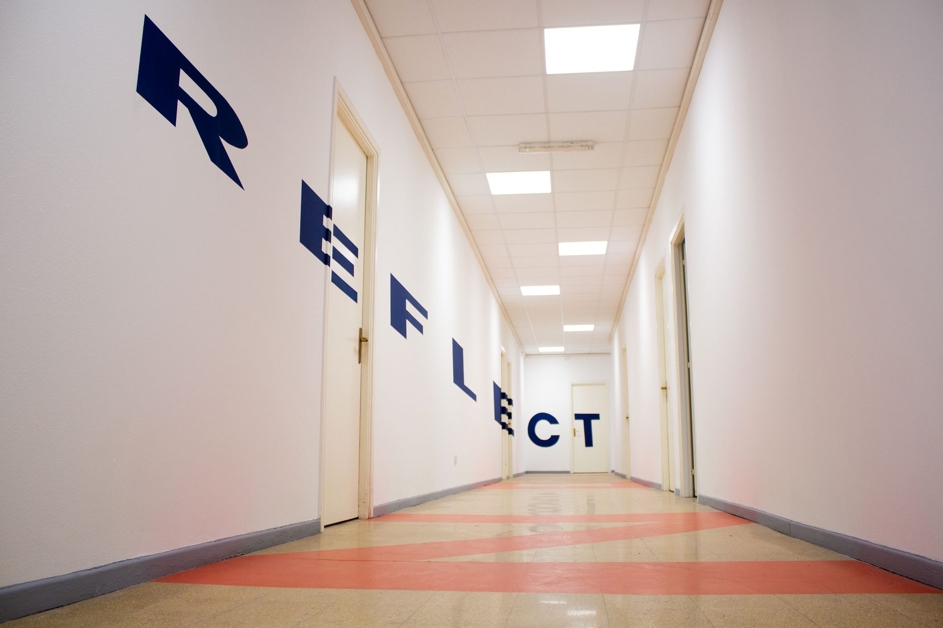 Corridor of the Unicollege Turin City College, lettered