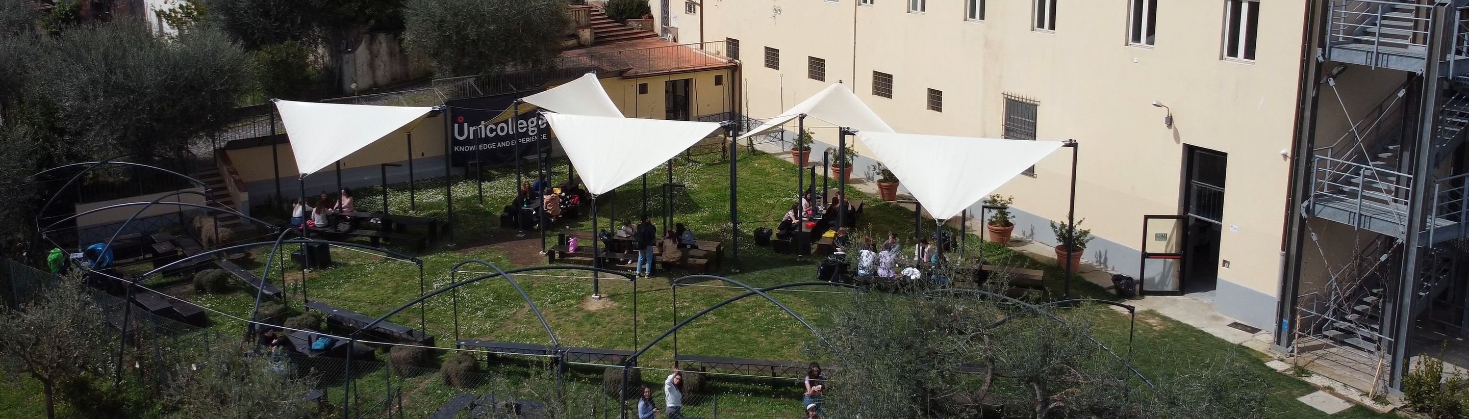 The garden of the Florence campus with the white tents where the Open Day takes place