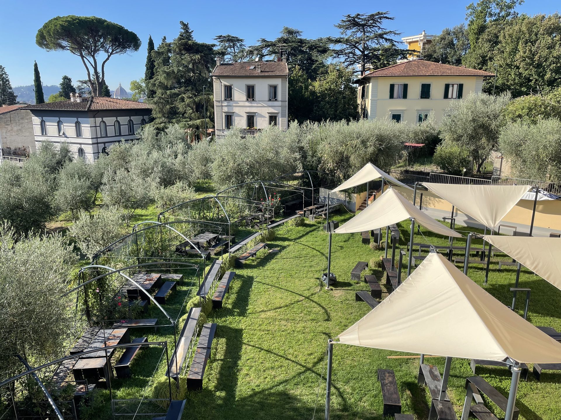 Olive grove and outdoor study area in the gardens of the Unicollege Florence Headquarters