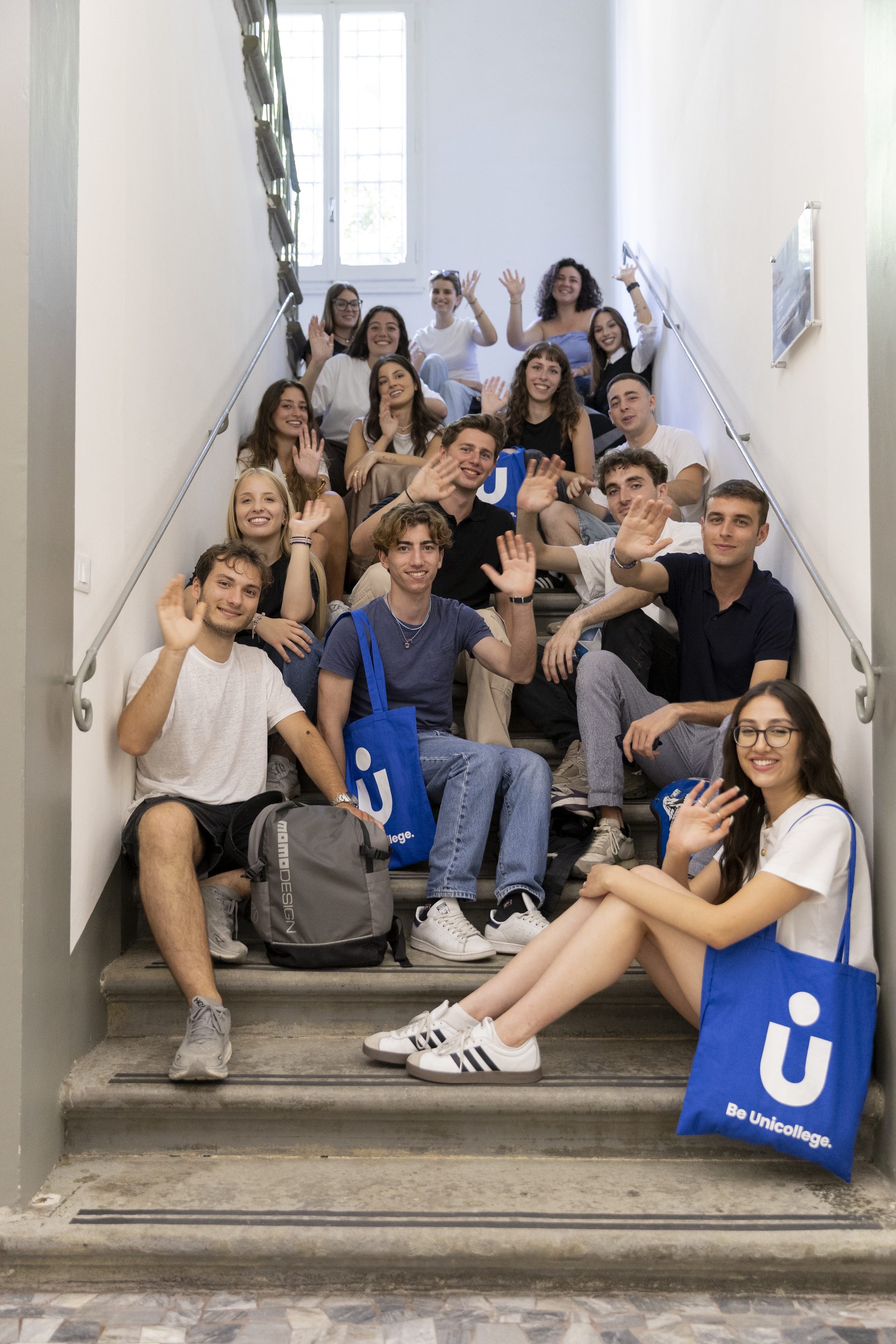 International students on the staircase of the Unicollege Florence Headquarters