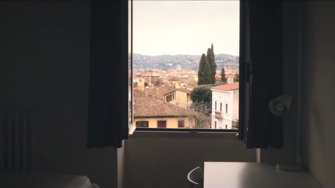 The rooftops of Florence seen from a student room window