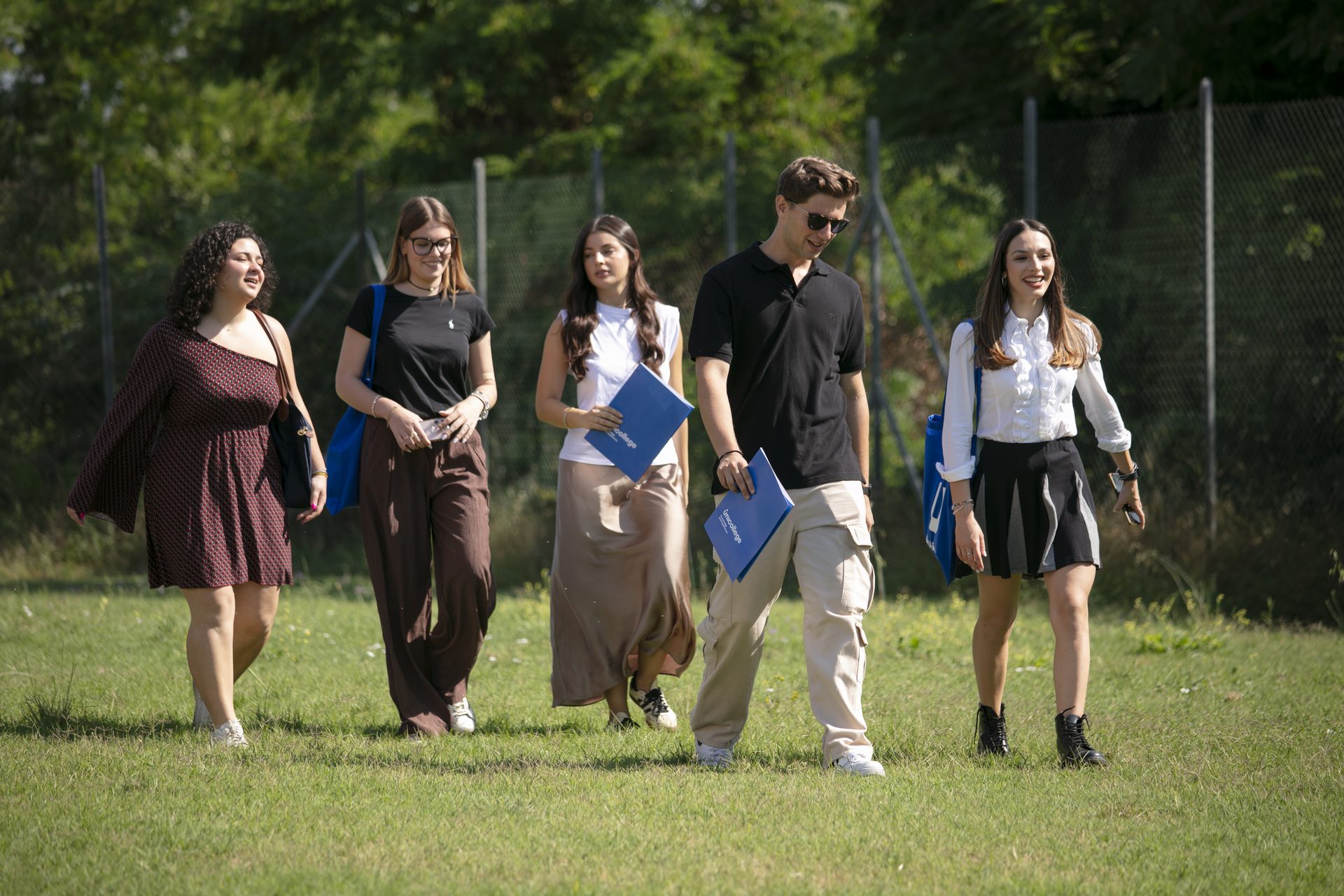 Students crossing the campus lawn at the Unicollege Florence Headquarters