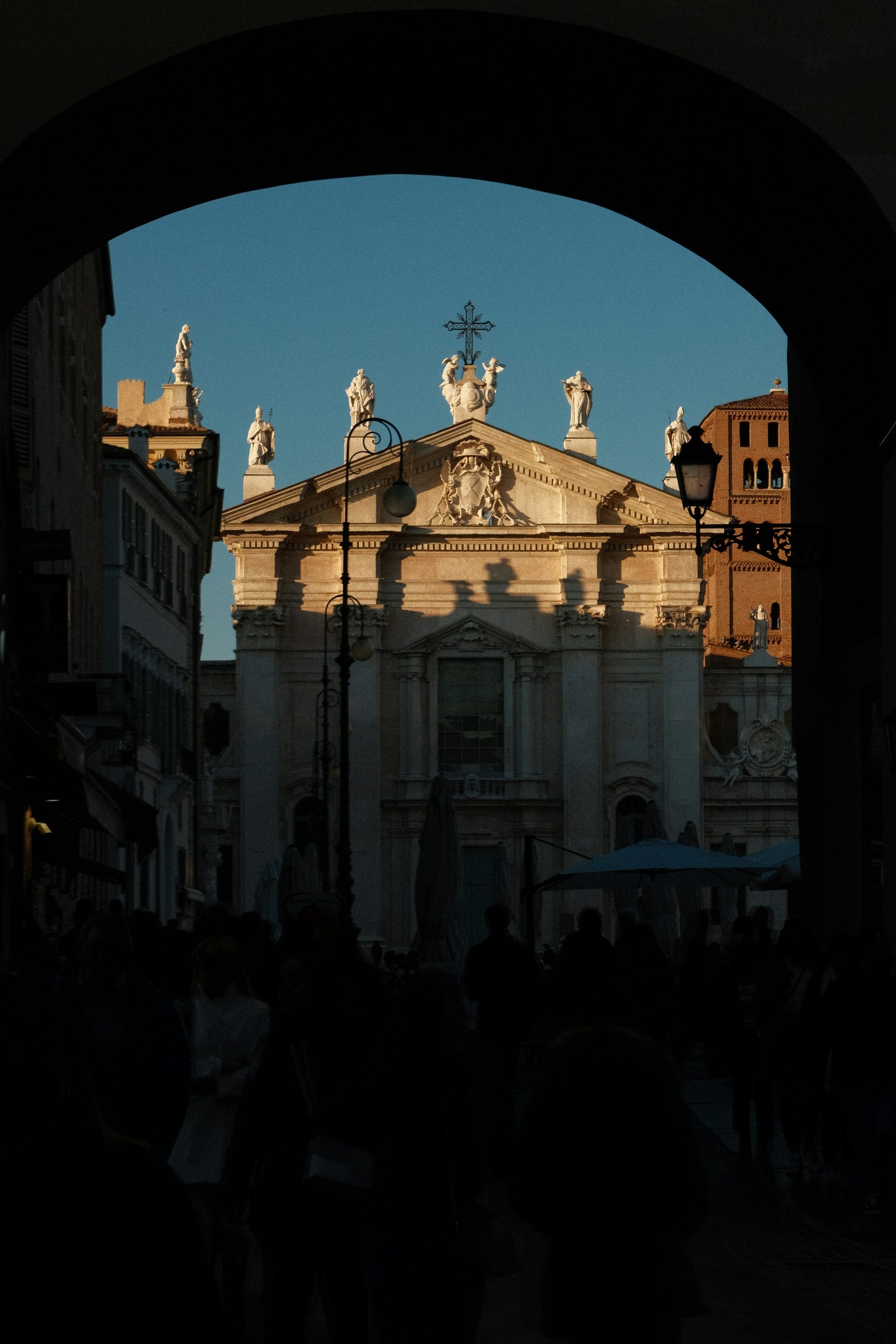 Leon Battista Alberti's Basilica of Sant'Andrea in Mantua, seen through an arch at night