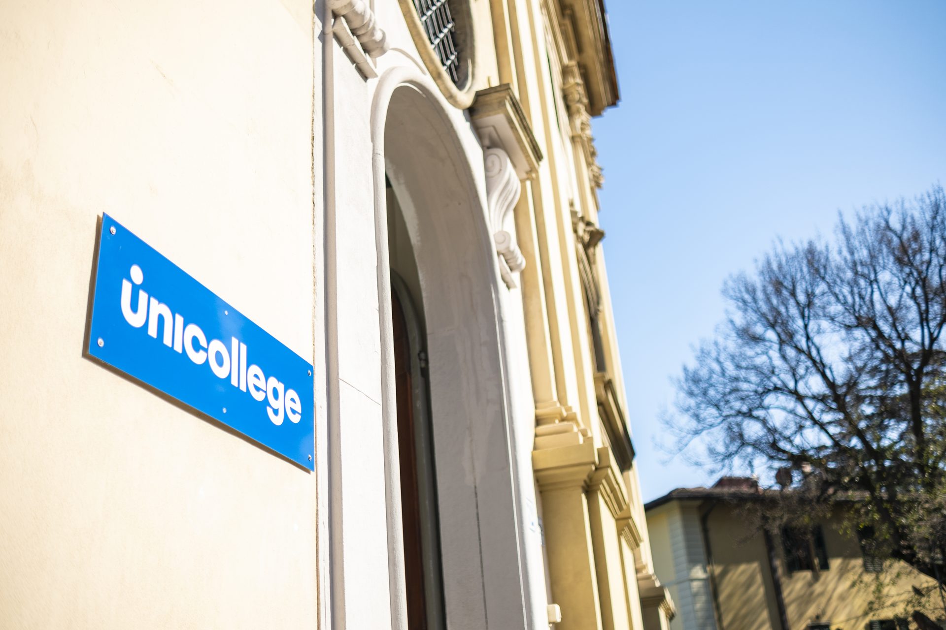 The Unicollege sign on the campus facade