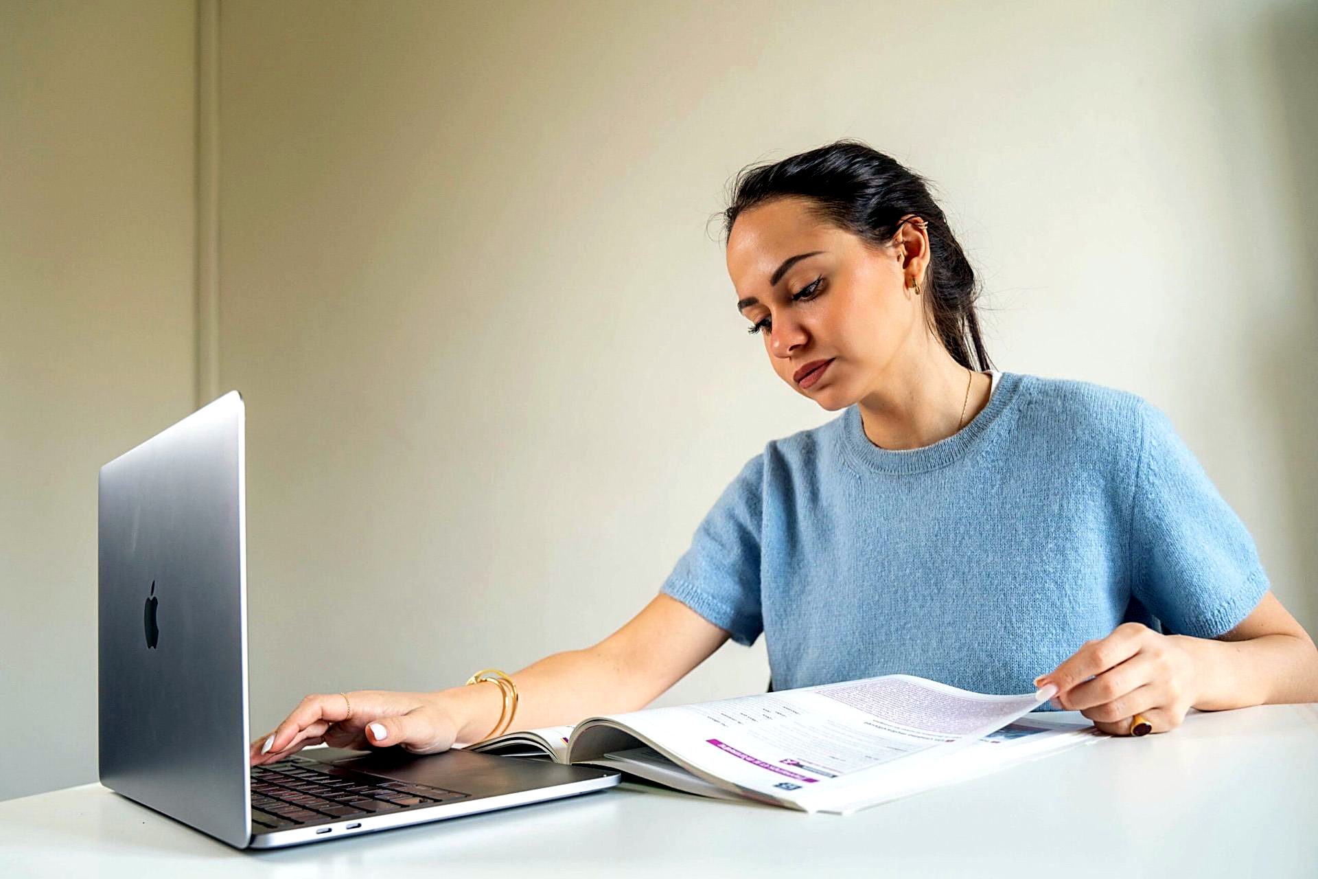 Student working on coursework with a laptop
