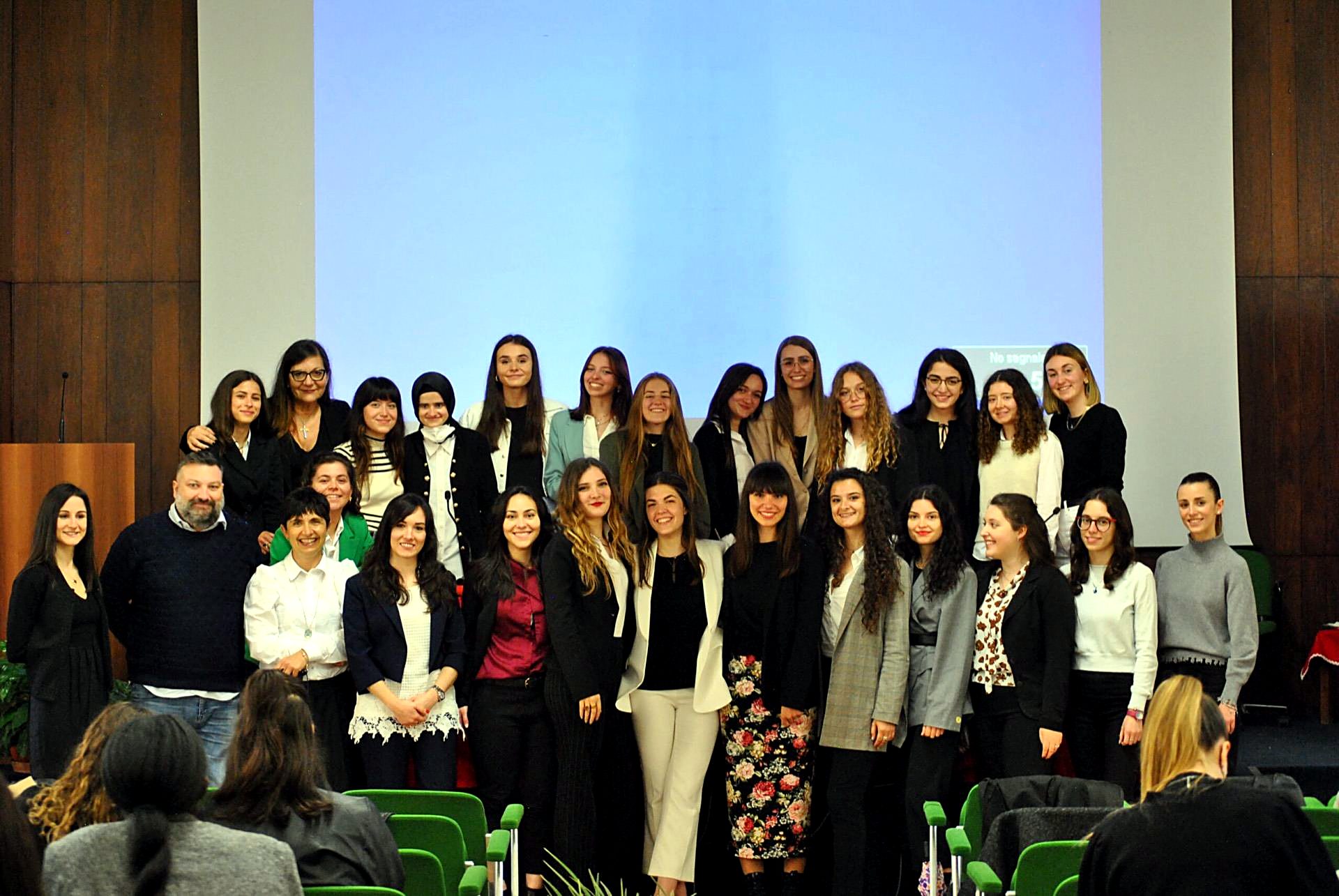 Group photo of Unicollege students in the auditorium