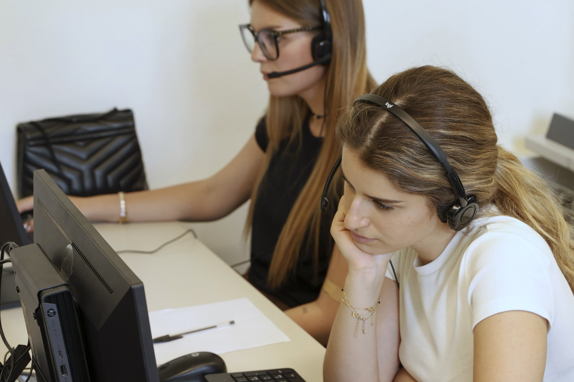 A student being guided at a language laboratory station